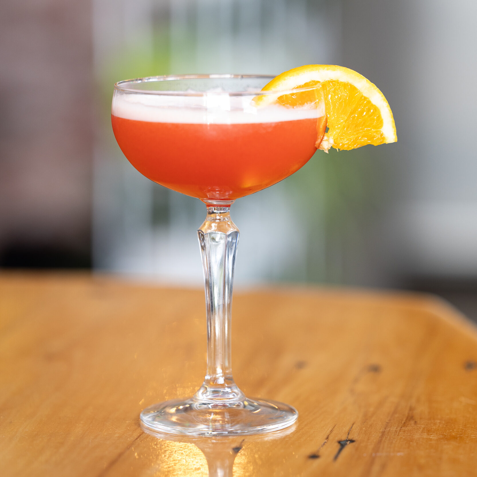 Bright pink and garnished with a slice of fresh orange, the Pink Lady is a favourite at Napier cocktail bar, The Gintrap.