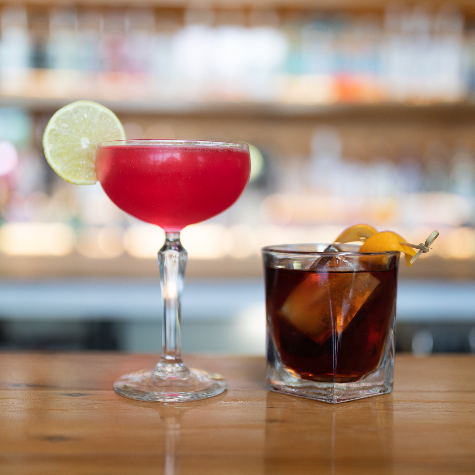 A selection of cocktails available at at Napier cocktail bar, The Gintrap, featuring Speakeasy Negroni and Pink Lady.